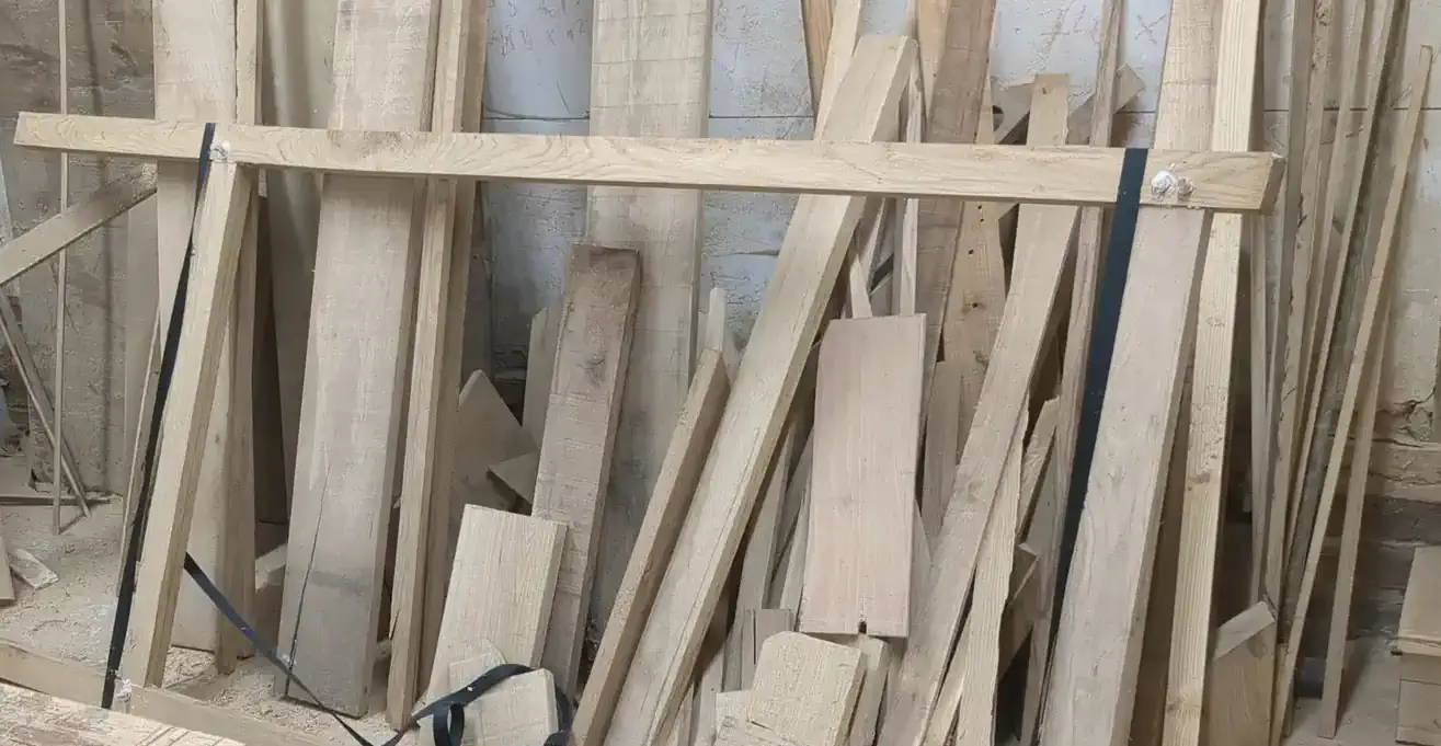 Oak boards and sections stacked in the Heritage Joiners workshop