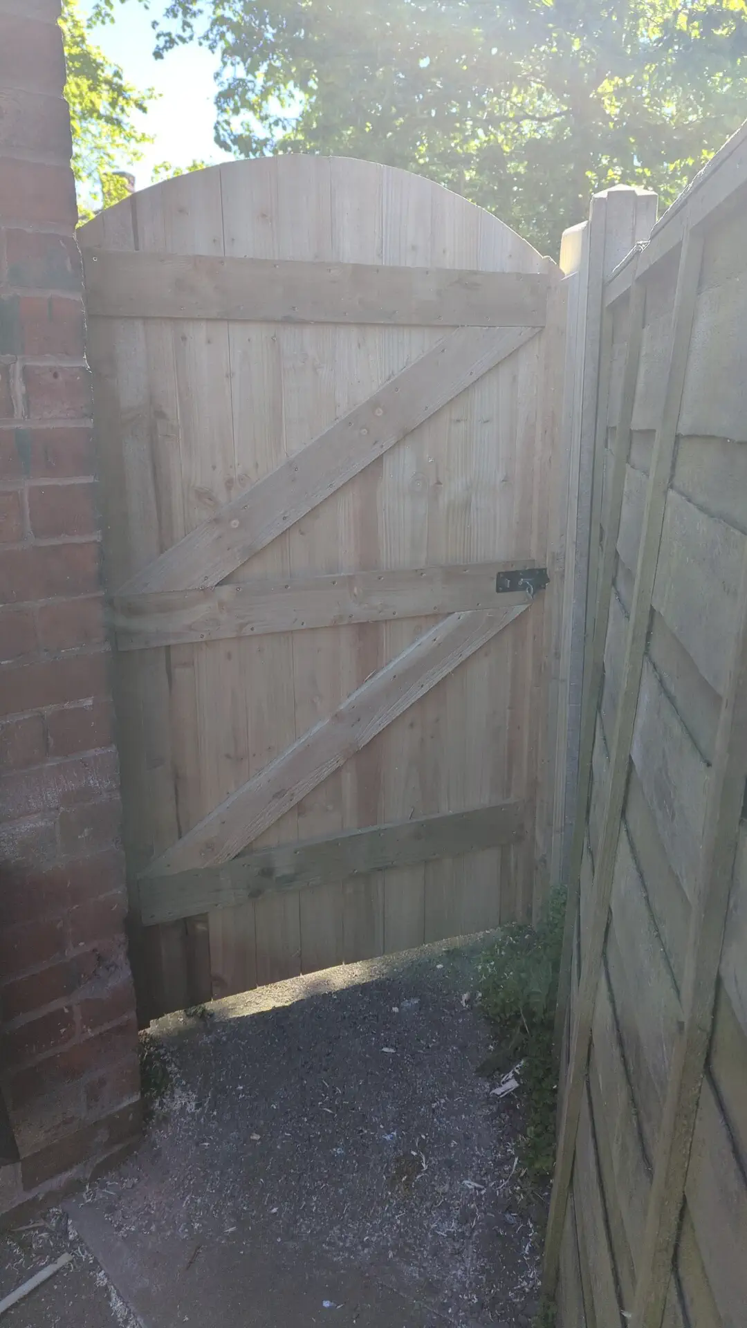 Finished ledged and braced garden gate hung and fitted in its opening