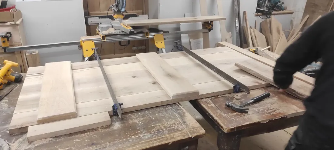 Oak door boards cramped up and set out on the bench for The Counting House