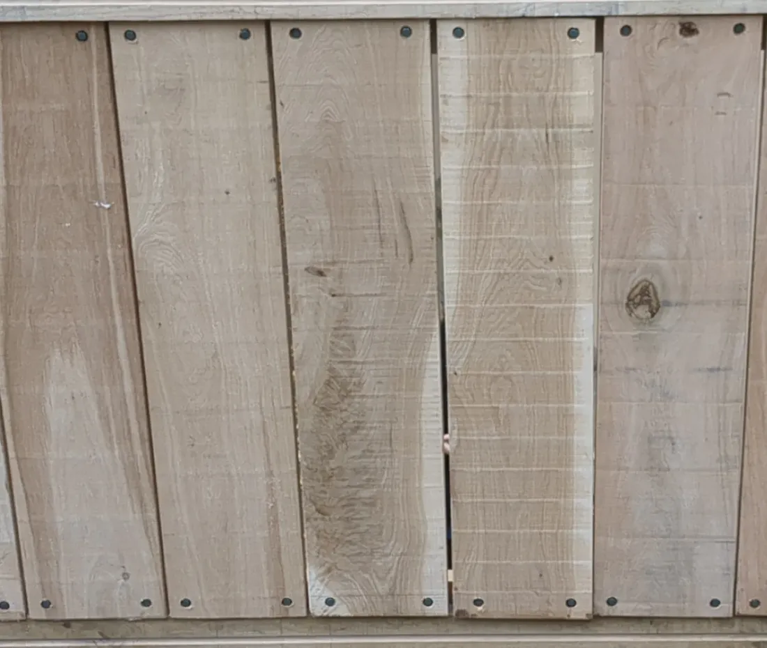Rustic sawn oak boarding fixed as vertical cladding