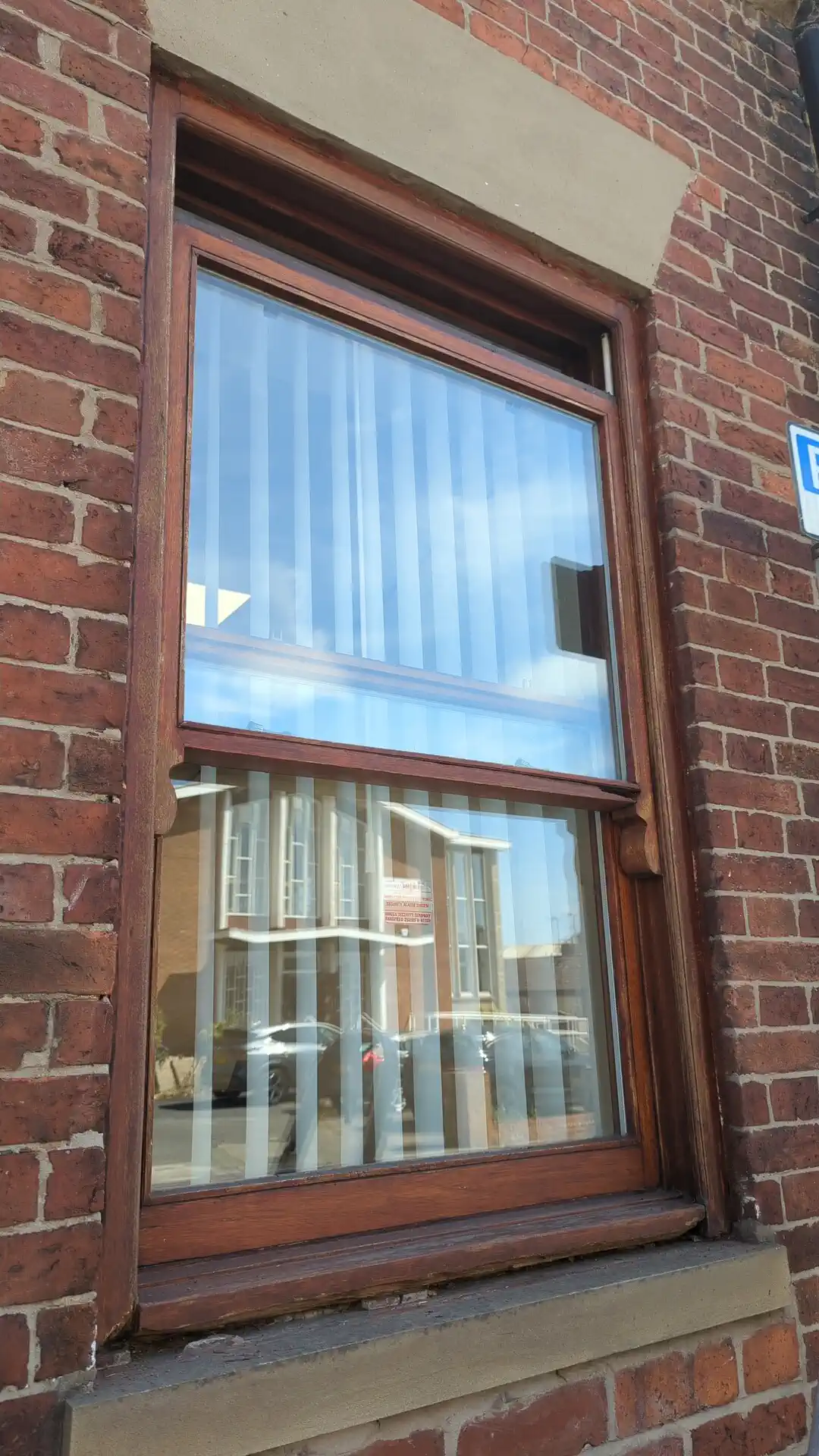 Upper sliding sash slid open again after being freed on a timber sash window in Pontefract