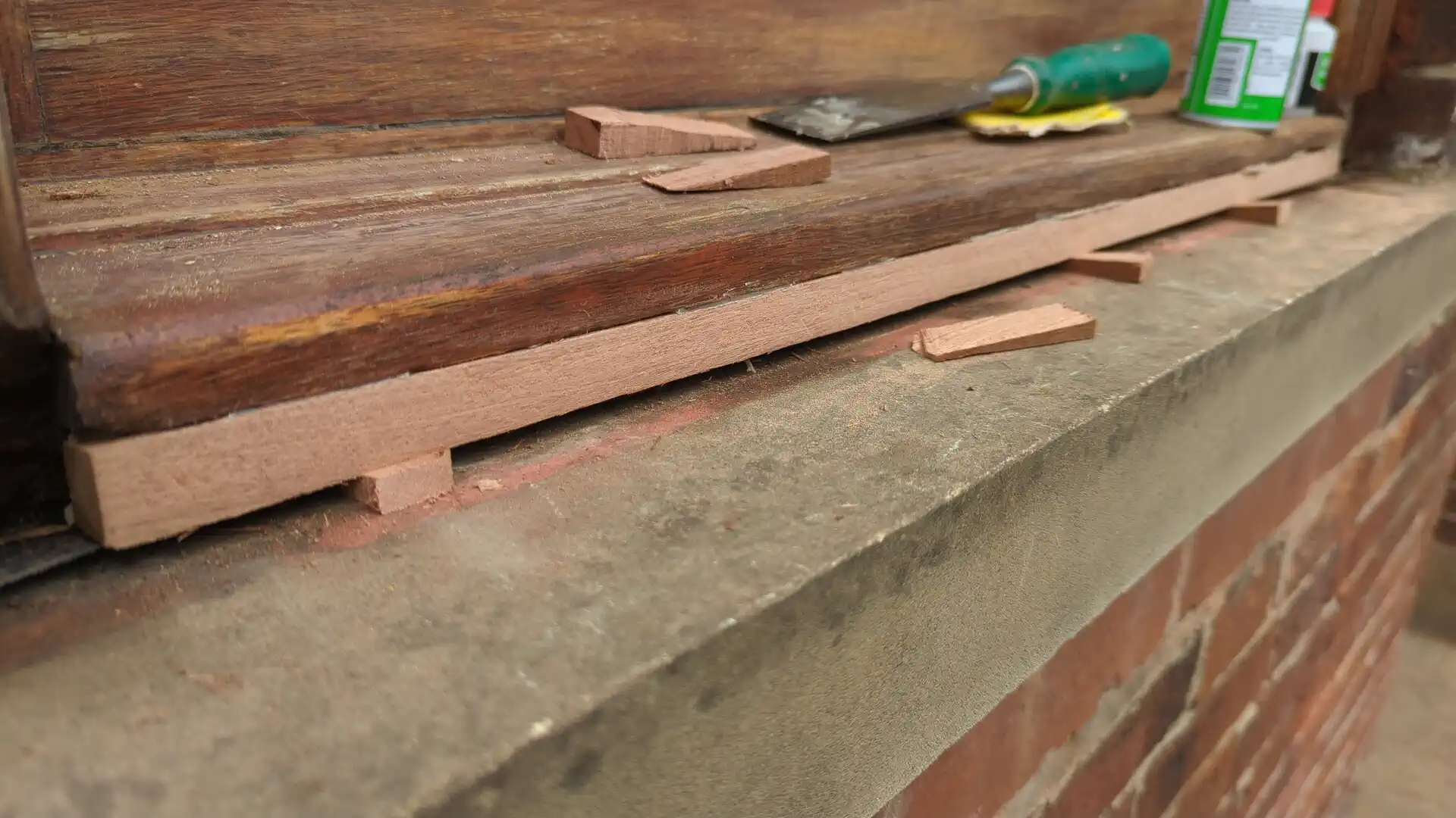 New sapele shaped and fitted where a decayed window sill section had failed, with the rest of the window retained