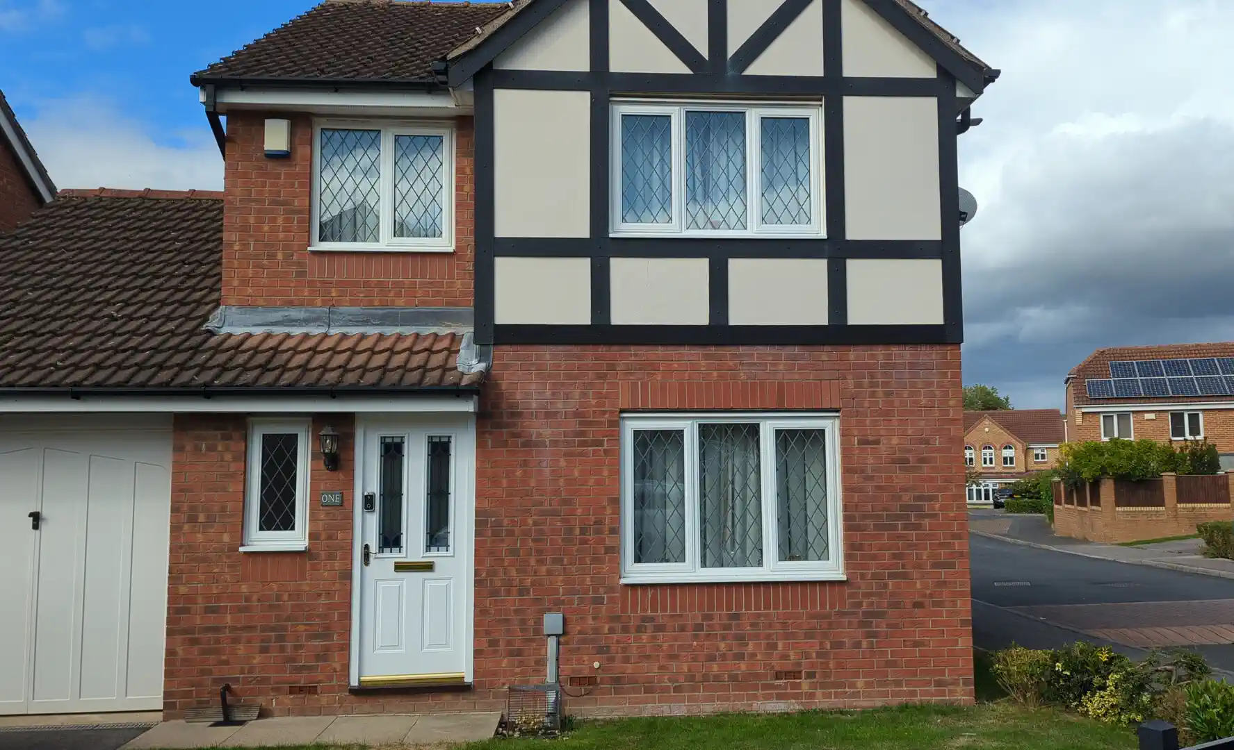 Mock-Tudor boarded frontage in Whitwood, Castleford after the failed lower board was replaced and matched