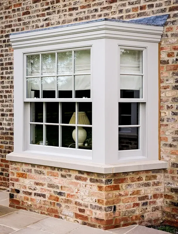 Sash bay window with glazing bars on a brick period property