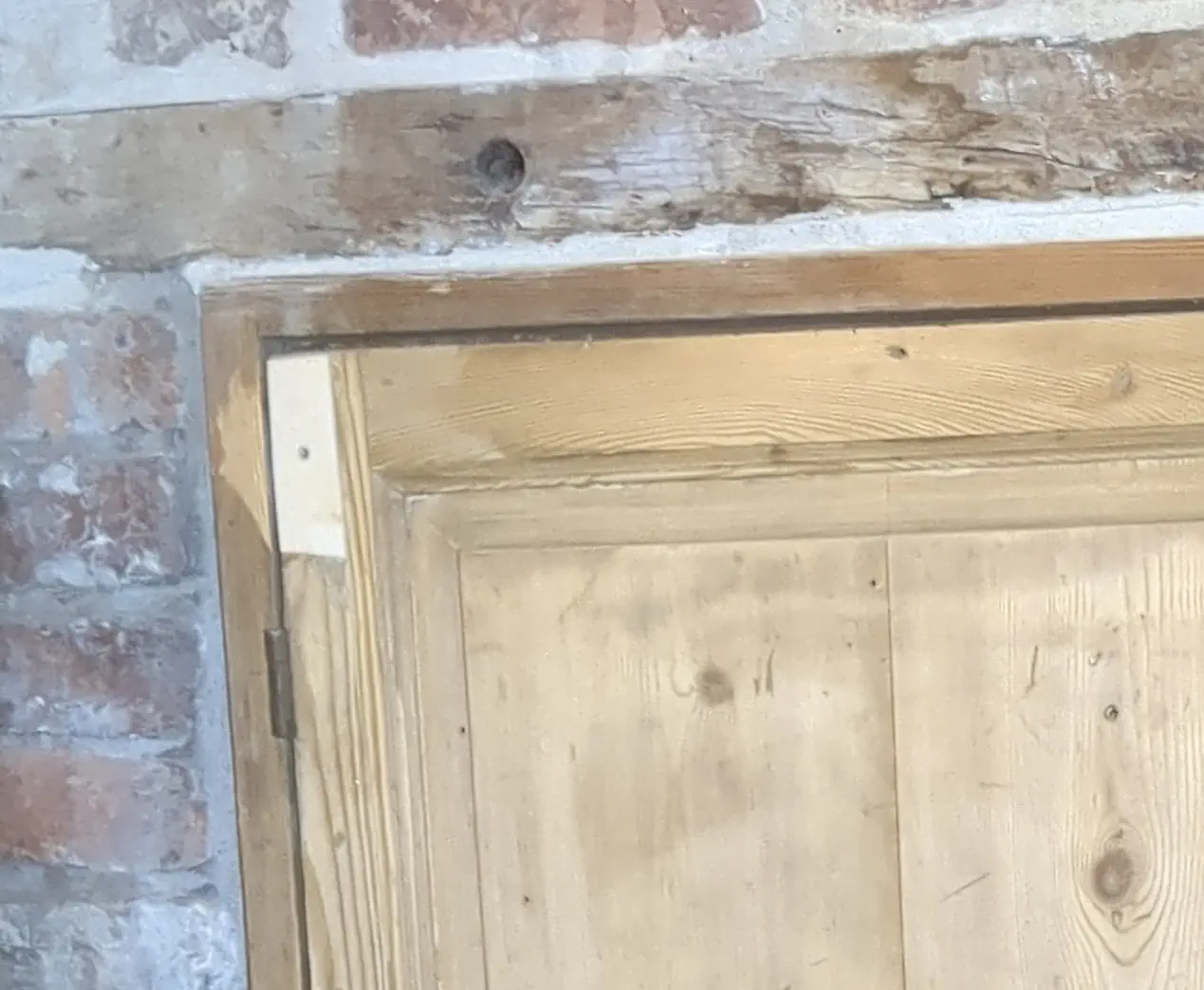 New timber section spliced into the corner of an original door frame