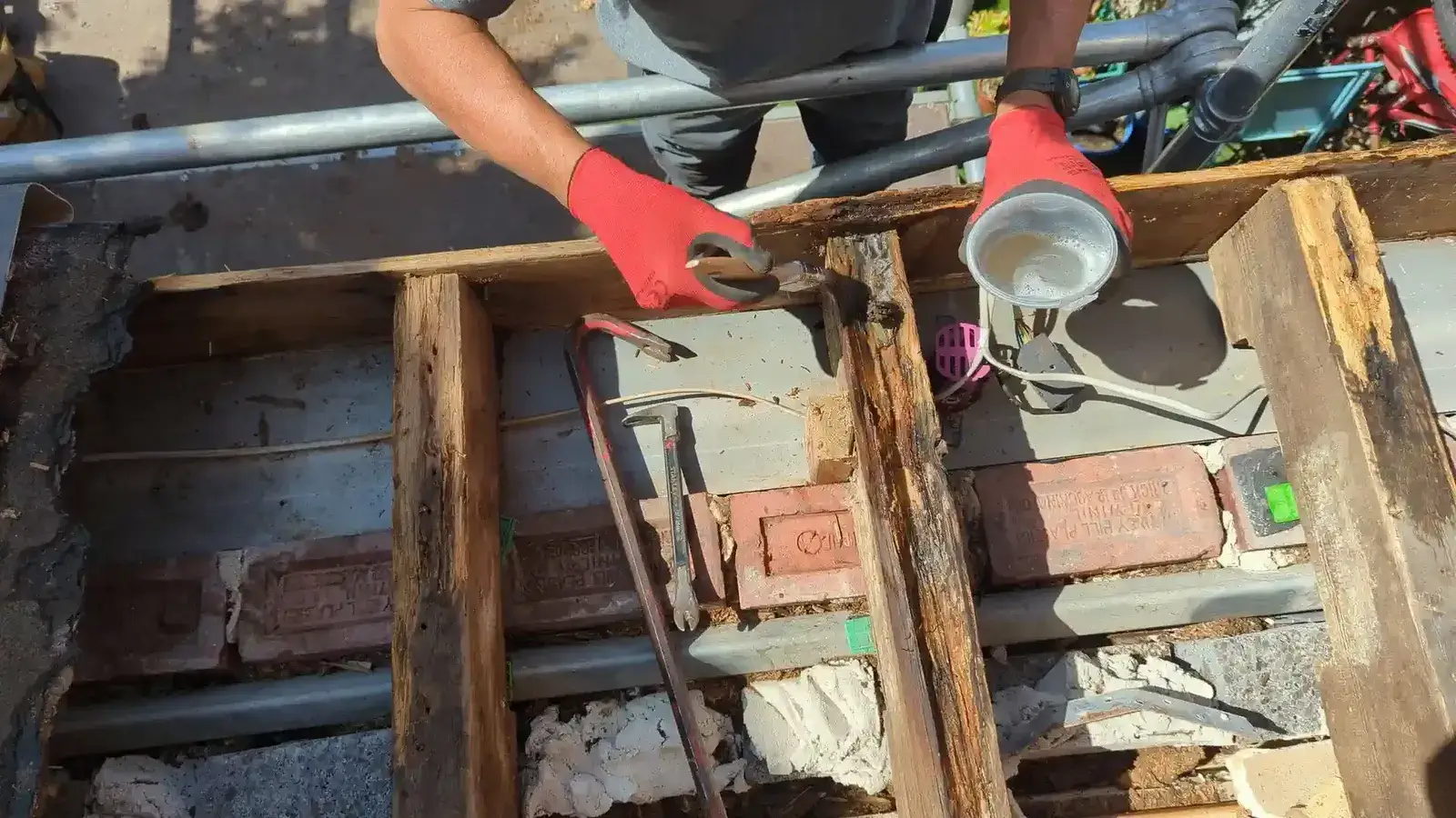 Timber treatment being applied to retained roof joists